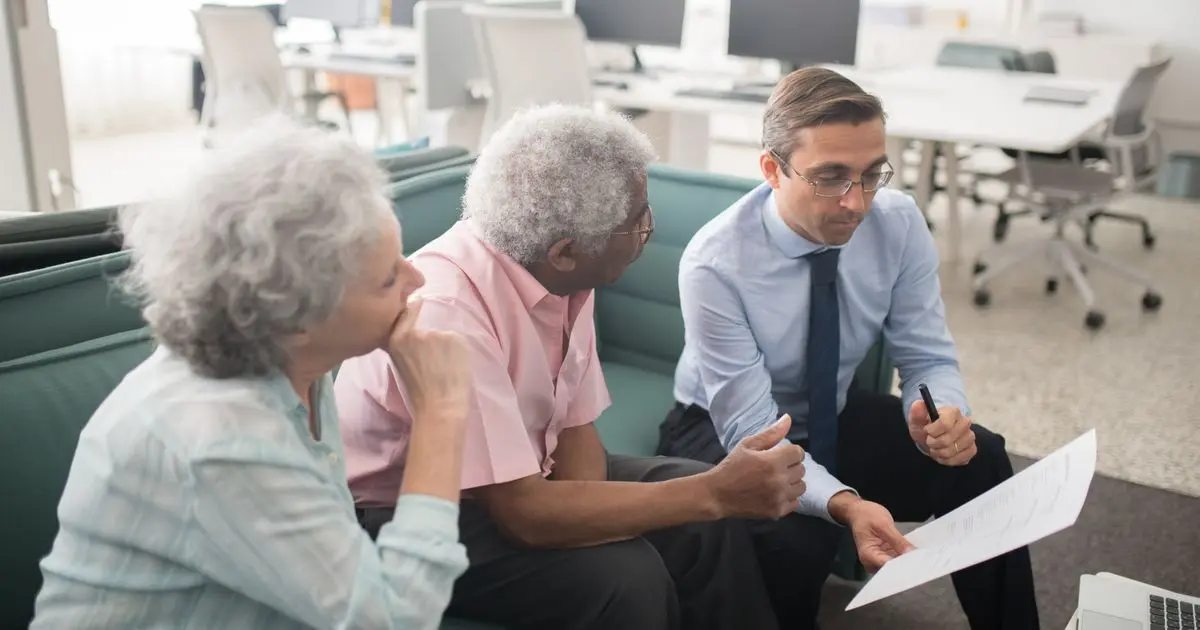 Credit counsellor meeting borrowers about payday loan debt help