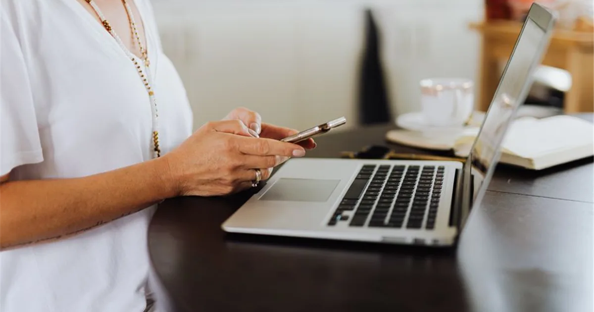 Applying online for e-transfer payday loans in Canada on phone and laptop