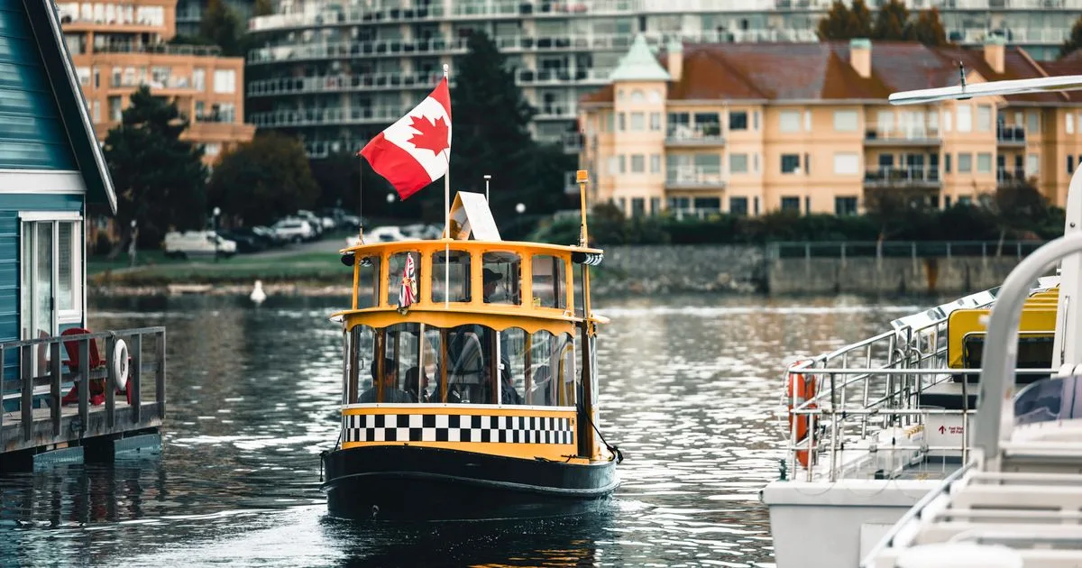 Victoria Inner Harbour water taxi with Canadian flag - payday loans Victoria