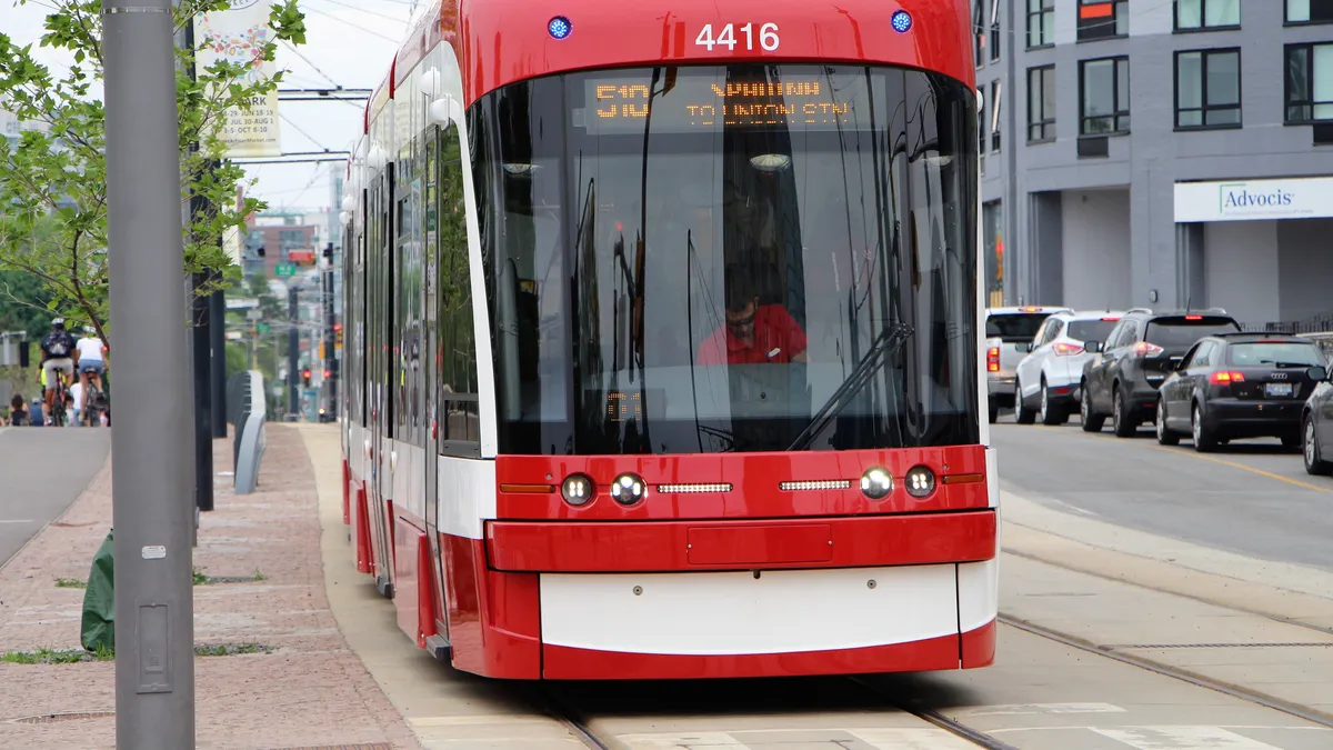 Red Toronto streetcar on Spadina Avenue, where Ontario's payday rules apply to every $300 payday loan